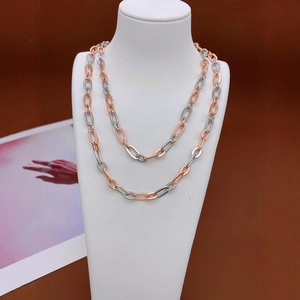 Two-tone rose gold and silver layered link chain necklace on jewelry bust stand