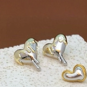 Lava-style fluid heart earrings with gold and silver two-tone polished finish