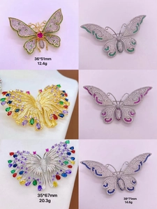 Macro shot of colorful micro-set zircon butterfly brooches in various sizes and finishes