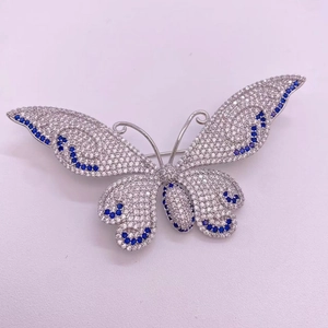 Elegant butterfly brooch with micro-pave cubic zirconia and deep blue gemstones in silver