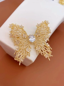 Elegant gold butterfly brooch featuring sparkling white zircons and hollow wing design
