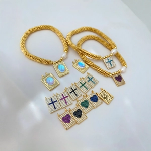 Classic gold beaded bracelets with heart and cross pendants featuring colorful zircon stones