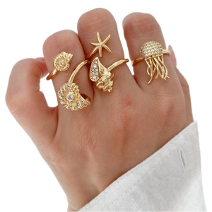 Golden ocean series ring set with starfish and jellyfish charms and zircon stones