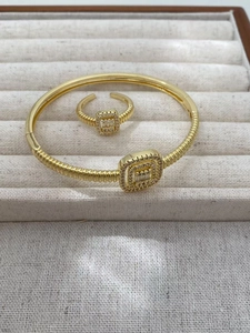 Gold square halo ring and bracelet set with twisted band texture and zircon accents