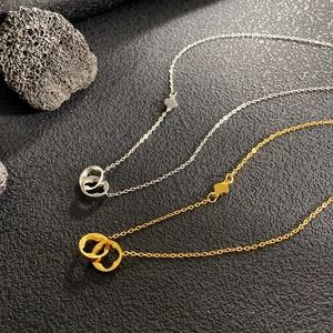Collares de acero inoxidable dorado y plateado con anillos entrelazados y trébol de suerte