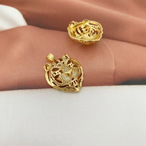 Iced out tiger head pendant in 18K gold plating with sparkling crystals and hollow design