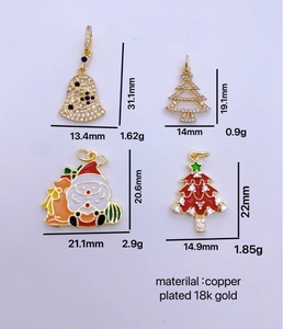 Detailed view of Christmas charms including Santa and bells with size and weight specs