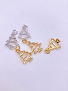 Detailed macro view of gold and silver Christmas tree pendants with sparkling crystals