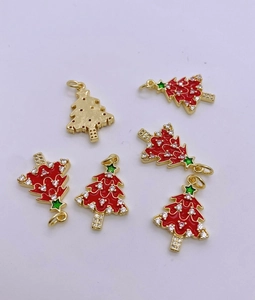 Detail showing red enamel Christmas tree alloy pendants with white zircon inlays