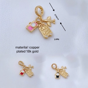 Travel pendant set with camera, plane, and suitcase in 18k gold plated copper finish
