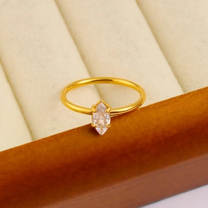 Macro view of 18K gold plated ring with marquise-cut zircon on velvet jewelry box