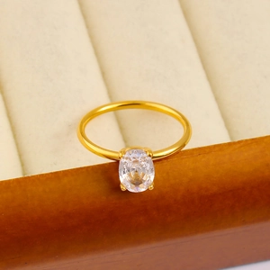 Macro detail of oval zircon ring with 18K gold plating and four-prong setting