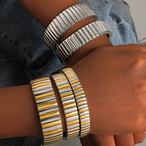 Elastic stainless steel stretch bracelet set in silver and gold two-tone metallic finish