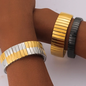 Detail view of elastic stainless steel watch band bracelets in gold, silver and black finish