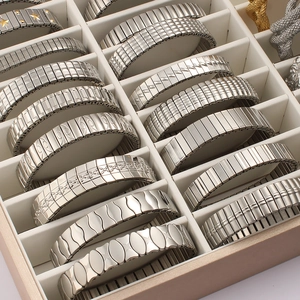 Elastic stainless steel watch band bracelets with textured patterns in a display box