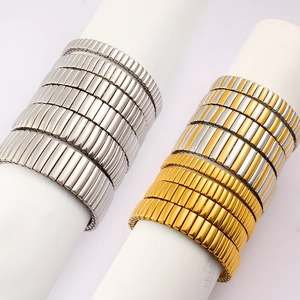 Detailed macro of gold and silver elastic stainless steel stretch watch band bracelets