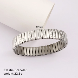 Detailed macro of a 12mm silver elastic stainless steel bracelet with engraved patterns