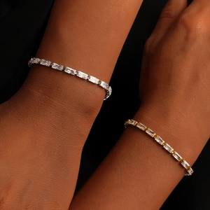 Elegant 18K gold and silver square zircon bracelets on wrist with black background