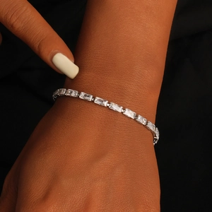 Elegant silver-tone tennis bracelet with rectangular cubic zirconia on a wrist