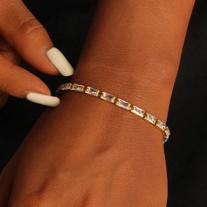 Elegant 18K gold plated tennis bracelet featuring square cubic zirconia on a female wrist