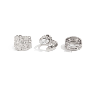 Three-piece silver liquid metal rings with lava texture and marquise zircon accents