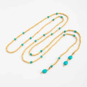 Lange gouden kralenketting met turquoise stenen en een bohemian ovale hanger