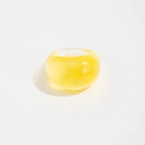 Detailed view of bold yellow transparent resin ring with polished dome finish