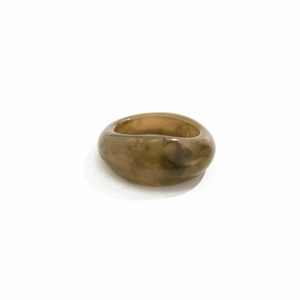 Detailed view of amber marble resin ring with smooth texture and modern polish