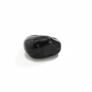 Detailed macro shot of a polished black resin ring with a glossy smooth surface texture