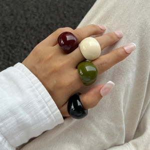 Minimalist thick colorful resin rings set in burgundy, ivory, olive green, and black colors