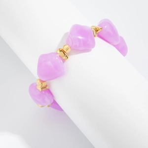 Detail of beaded choker featuring irregular lavender resin beads and gold heart spacers