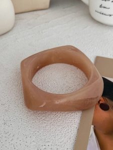 Detail of chunky geometric square resin bracelet in nude pink with marble texture