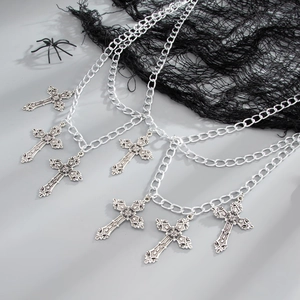 Gothic metal body chain featuring layered horse chains and engraved cross pendants