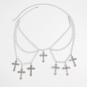Detail of silver gothic body chain featuring triple layers and carved cross pendants