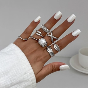 7-piece silver droplet ring set with baroque pearl and minimalist wave textures
