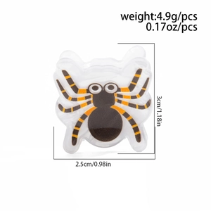 Détail de la pince à cheveux araignée Halloween avec pattes orange et taille 3cm x 2,5cm