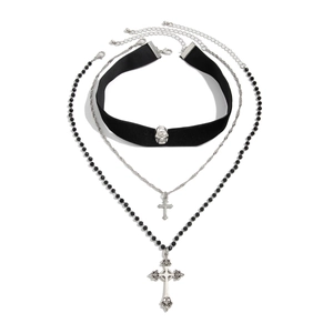 Detailed view of punk cross pendant necklace set with skull choker and beaded chain