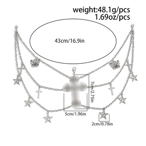 Macro view of gothic silver body chain featuring hollow butterfly and star charms