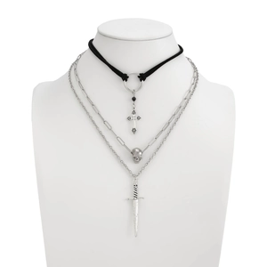 Gothic multi-layer necklace with cross, skull and dagger pendants on model