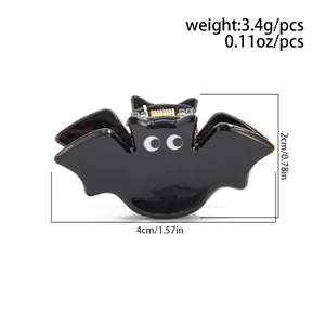 Détail de la pince à cheveux chauve-souris noire avec dimensions 4cm x 2cm et poids 3,4g