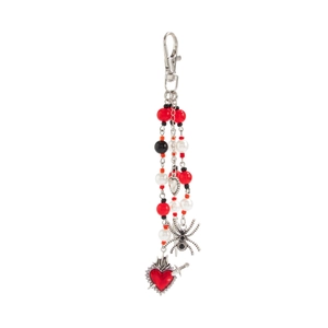Detail of beaded trousers chain with spider and red enamel heart charms and spring hook