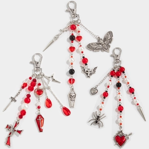 Gothic cross and heart keychain set with silver chains, skull charms, and colorful beads