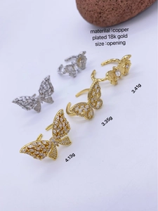 Detailed macro view of 18k gold plated copper butterfly rings with zircon butterfly wings