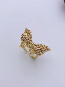 Detail showing butterfly zircon ring with pavé-set stones and 18k gold-plated open band