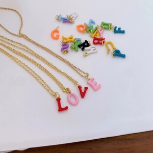 DIY 18K gold plated necklace with colorful enamel alphabet charms spelling LOVE