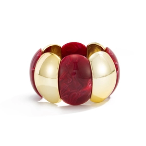 Detail of red marble resin blocks and polished gold metal segments on stretch bracelet