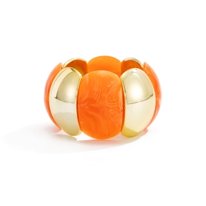 Detail of wide elastic bracelet with polished gold metal and amber resin blocks