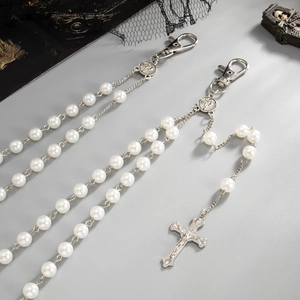 Gothic pearl waist chain with cross pendant and saint icon medal detail view