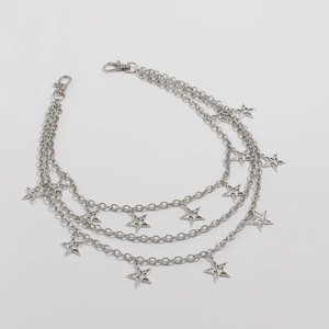 Detail of triple-layer silver star chain with lobster clasps for pants or waist belts