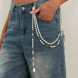 Chic multi-layer pearl waist chain with golden star tassels for denim pants styling
